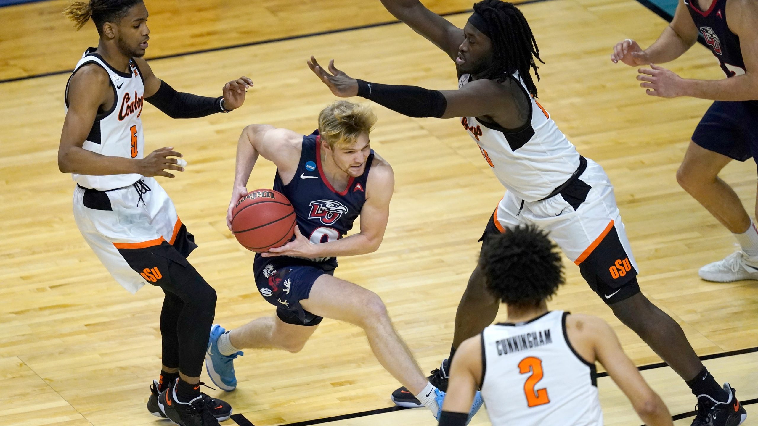 Liberty men fall short in NCAA opener to Oklahoma State, 69-60