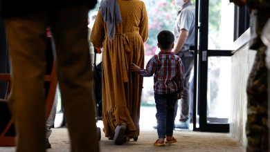 Afghan families start U.S. resettlement process at repurposed conference center after traumatic ordeals